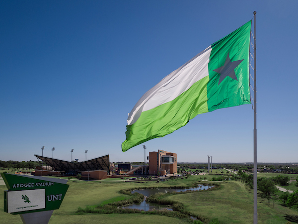 UNT Battle flag flying above UNT campus